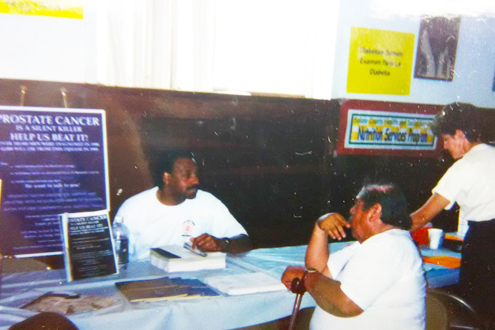 Photo of African American speaking with client